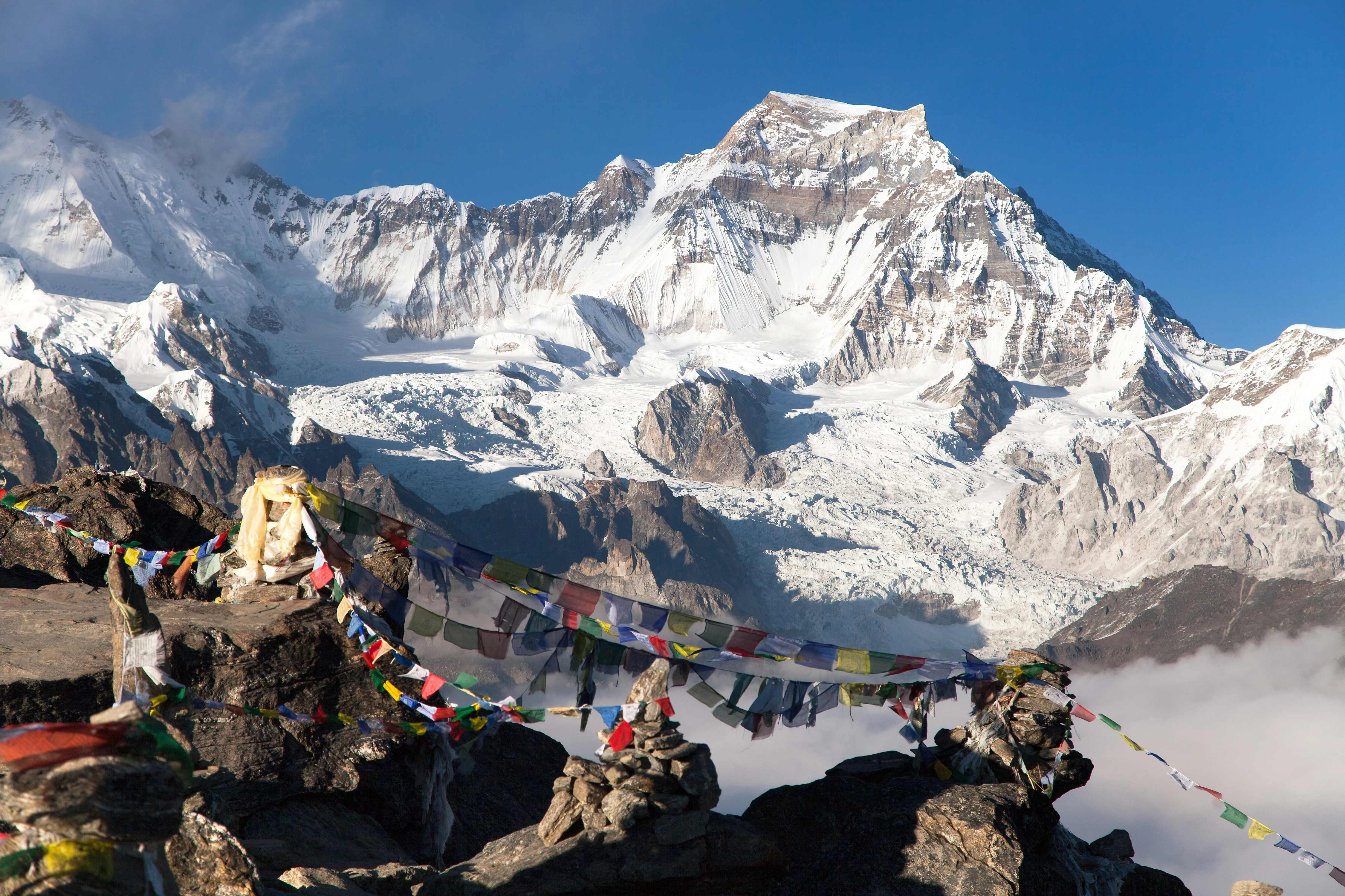 Mount Everest with colorful prayer flags in the foreground